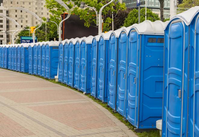 a row of portable restrooms at a fairground, offering visitors a clean and hassle-free experience in almond